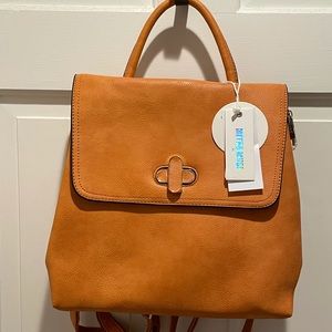 Tan convertible backpack.  Never been used